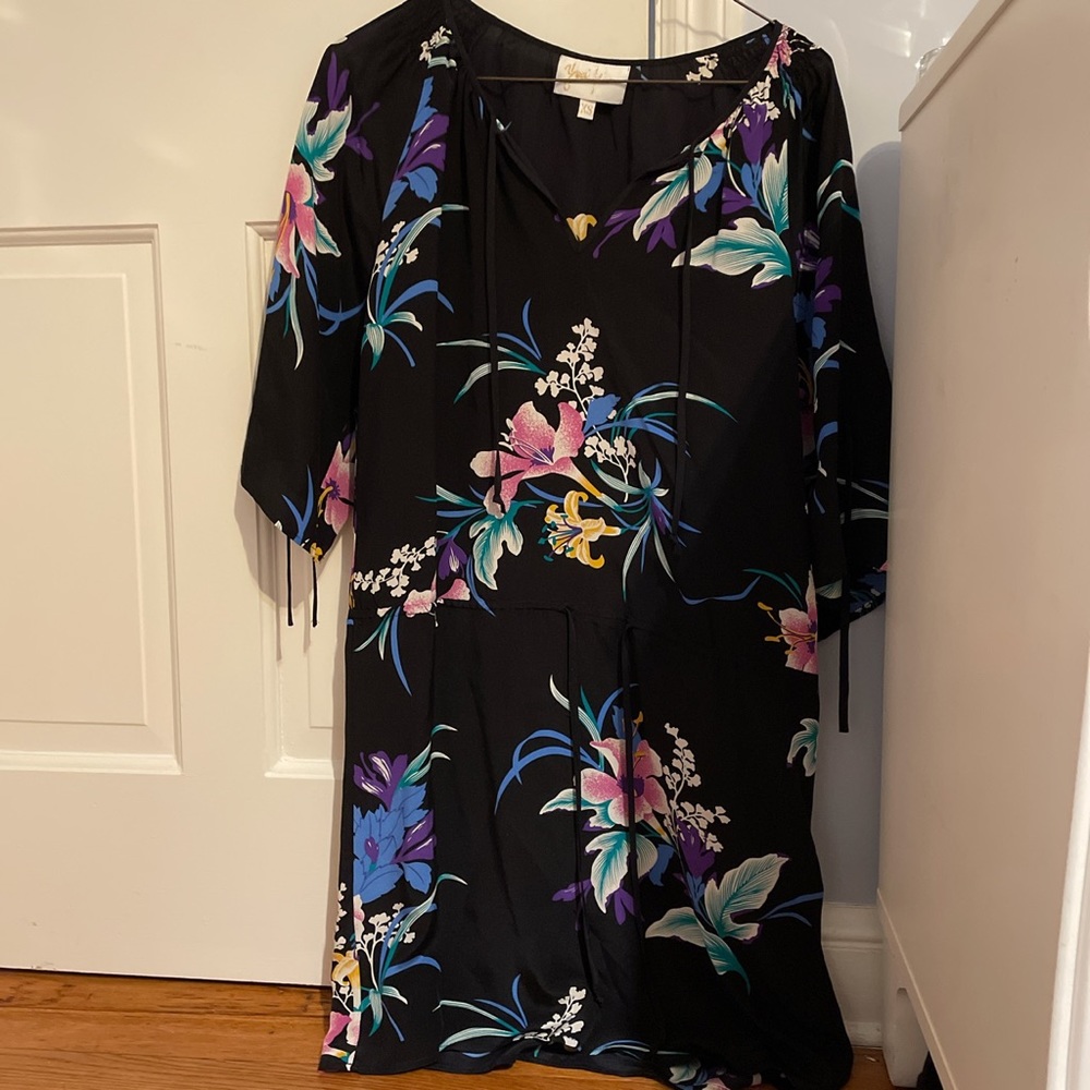 a black dress with different color flowers.